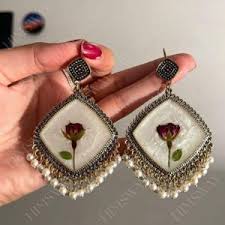 resin jhumka with red flower